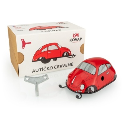 Carro de brinquedo de metal vermelho com chave de corda e caixa