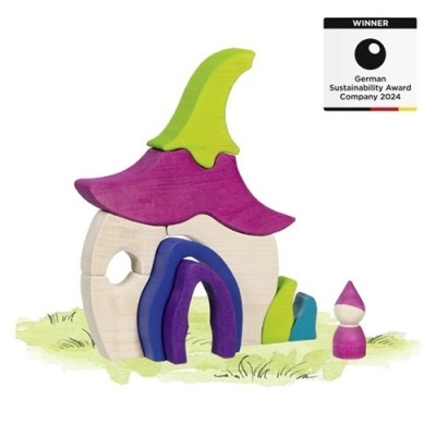 Brinquedo de madeira colorido em forma de casa e pequena figura humana