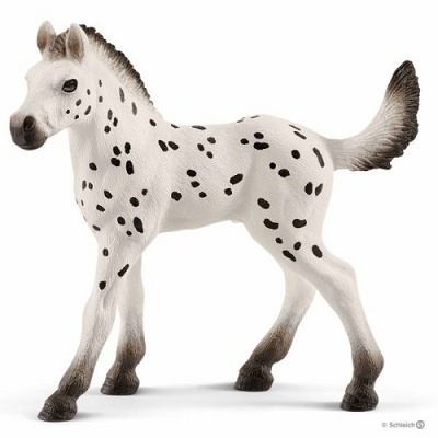 Figura de cavalo branco com manchas pretas e cauda eriçada