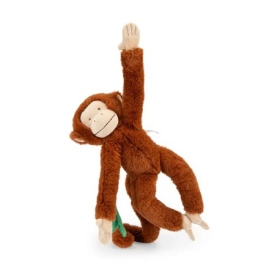 Peluche de macaco castanho pendurado com uma banana verde