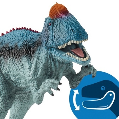 Brinquedo de dinossauro azul e vermelho com crista laranja e texto de movimento da mandíbula
