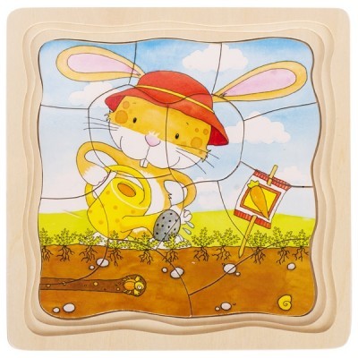 Puzzle de madeira infantil com desenho de coelho amarelo com chapéu vermelho e regador