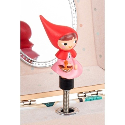 Figura decorativa pequena menina com capuz vermelho e vestido cor-de-rosa numa mola metálica junto a um espelho