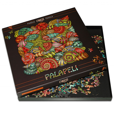 Caixa de puzzle PALAPELI com desenho colorido de conchas e estrela do mar