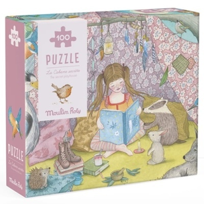 Caixa de puzzle com ilustração de menina lendo numa cabana com animais