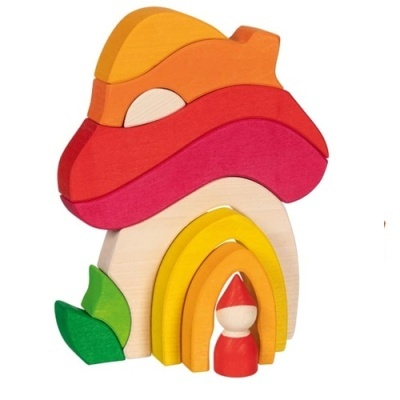 Brinquedo de madeira colorida em forma de cogumelo com figura humana pequena