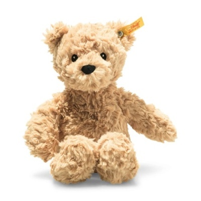 Ursinho de peluche castanho claro com etiqueta amarela na orelha