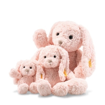 Três peluches cor-de-rosa em forma de coelho empilhados