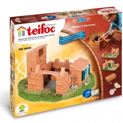 Caixa de jogo de construção teifoc com tijolos reais de cerâmica castanha e peças para montar uma pequena casa.