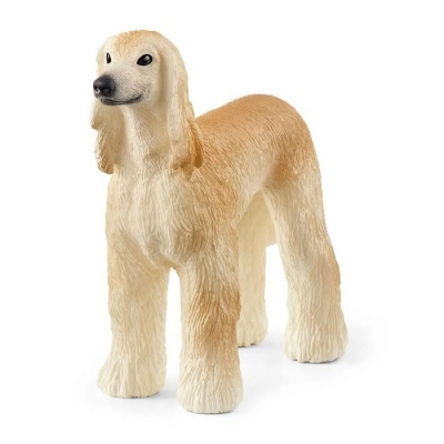 Figura decorativa de cão creme e bege com pêlo longo em fundo branco