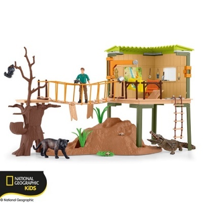 Brinquedo National Geographic Kids com cabana, animais e figura humana em cenário natural