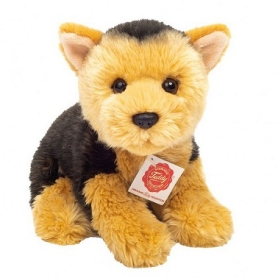 Pelúcia de cão castanho e preto com etiqueta