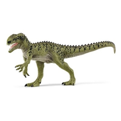 Figura de dinossauro verde com manchas pretas e textura rugosa