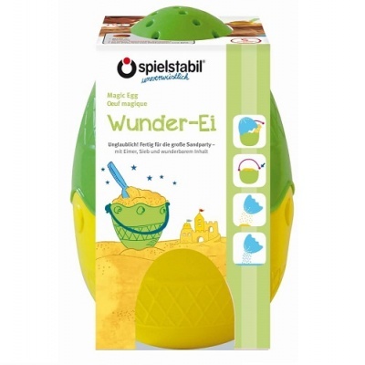 Brinquedo de areia Spielstabil 'Wunder-Ei' verde e amarelo na embalagem