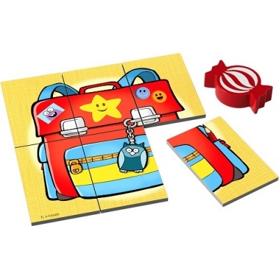 Puzzle infantil com mala colorida e peça vermelha em forma de caramelo
