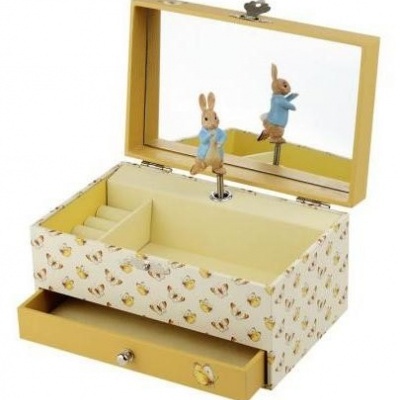 Caixa de música e joalharia amarela com padrão de coelhinhos e espelho