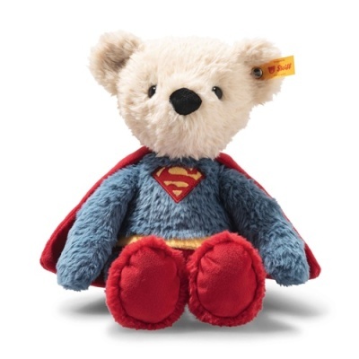 Urso de peluche vestido de super-herói com capa vermelha e símbolo S no peito