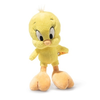 Peluche amarelo do personagem Titi com olhos grandes e pés cor de laranja