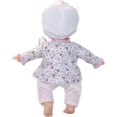 Boneca com roupa floral e calças cor-de-rosa vista de costas