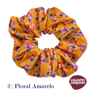 Elástico de cabelo floral amarelo com padrão colorido e etiqueta VALENTES