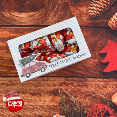 Caixa de chocolates de Natal com decoração e texto Feliz Natal Manuel