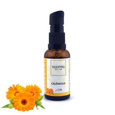 Frasco de vidro âmbar com doseador preto e flores de calêndula