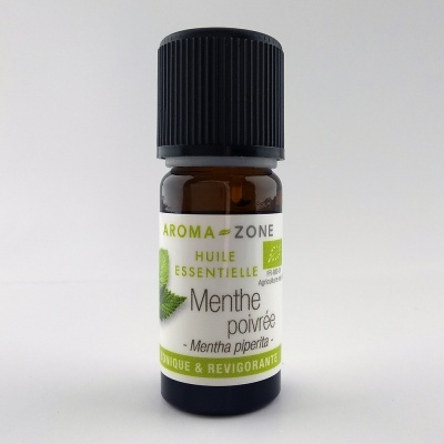 Frasco de óleo essencial de mentha poivrée em vidro âmbar com rótulo branco e verde