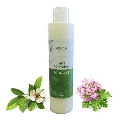 Frasco de leite corporal para psoríase VALENTINA BODY CARE com folhas e flores ao lado