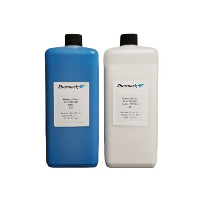 Duas embalagens de pasta de silicone Zhermack, uma azul e uma branca, com etiquetas detalhadas.