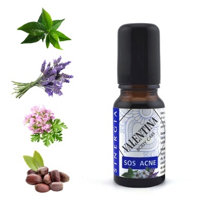Frasco de óleo SOS Acne com ingredientes naturais ao lado