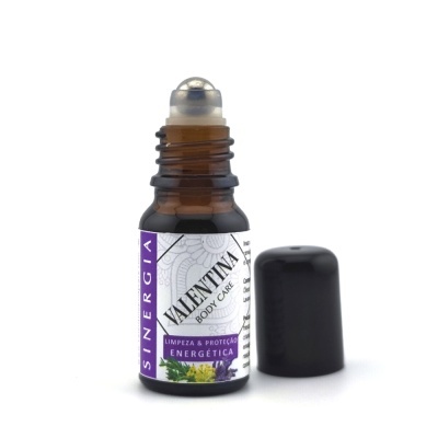 Frasco de vidro âmbar com rolamento metálico e rótulo branco com texto