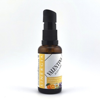 frasco de óleo corporal Valentia da linha Sinergia com tampa preta e rótulo branco e amarelo