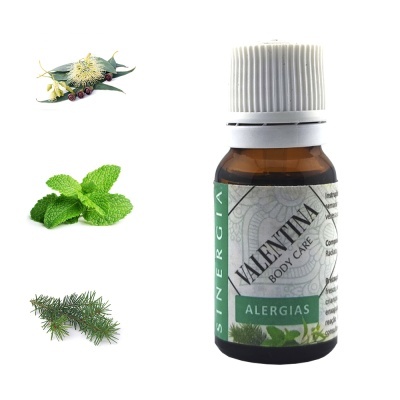 Frasco de óleo essencial Valentina Body Care para alergias com folhas e flores ao redor