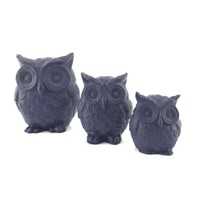 Três esculturas decorativas de coruja negras em relevo