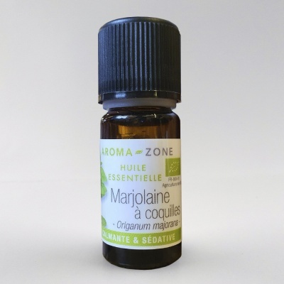 Frasco pequeno de óleo essencial Marjolaine à coquilles com rótulo branco e tampa preta