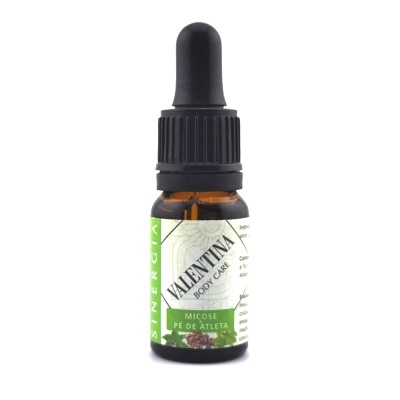 Frasco pequeno de vidro âmbar com tampa preta gota a gota e rótulo verde e branco