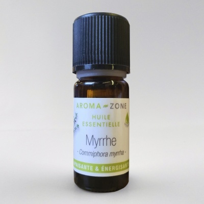 Frasco de óleo essencial de mirra com etiqueta branca e tampa preta