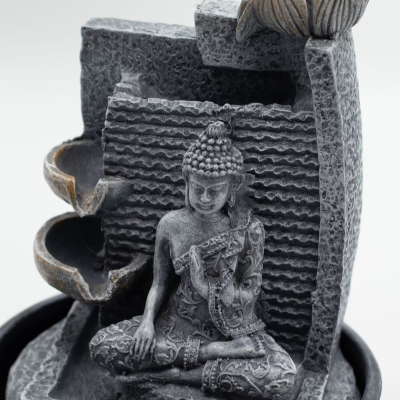 Incensário decorativo em pedra com figura de Buda sentado