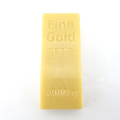 Barra de ouro fina dourada com texto gravado