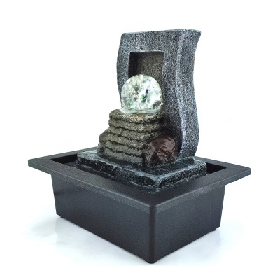 Fonte decorativa de mesa cinza com esfera transparente e base preta