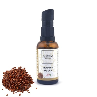 Frasco de produto Valentina Body Care com graínhas de uva ao lado