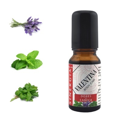 Frasco de óleo essencial com rótulo Valentina Body Care dores cabeça, raminhos de plantas e flores