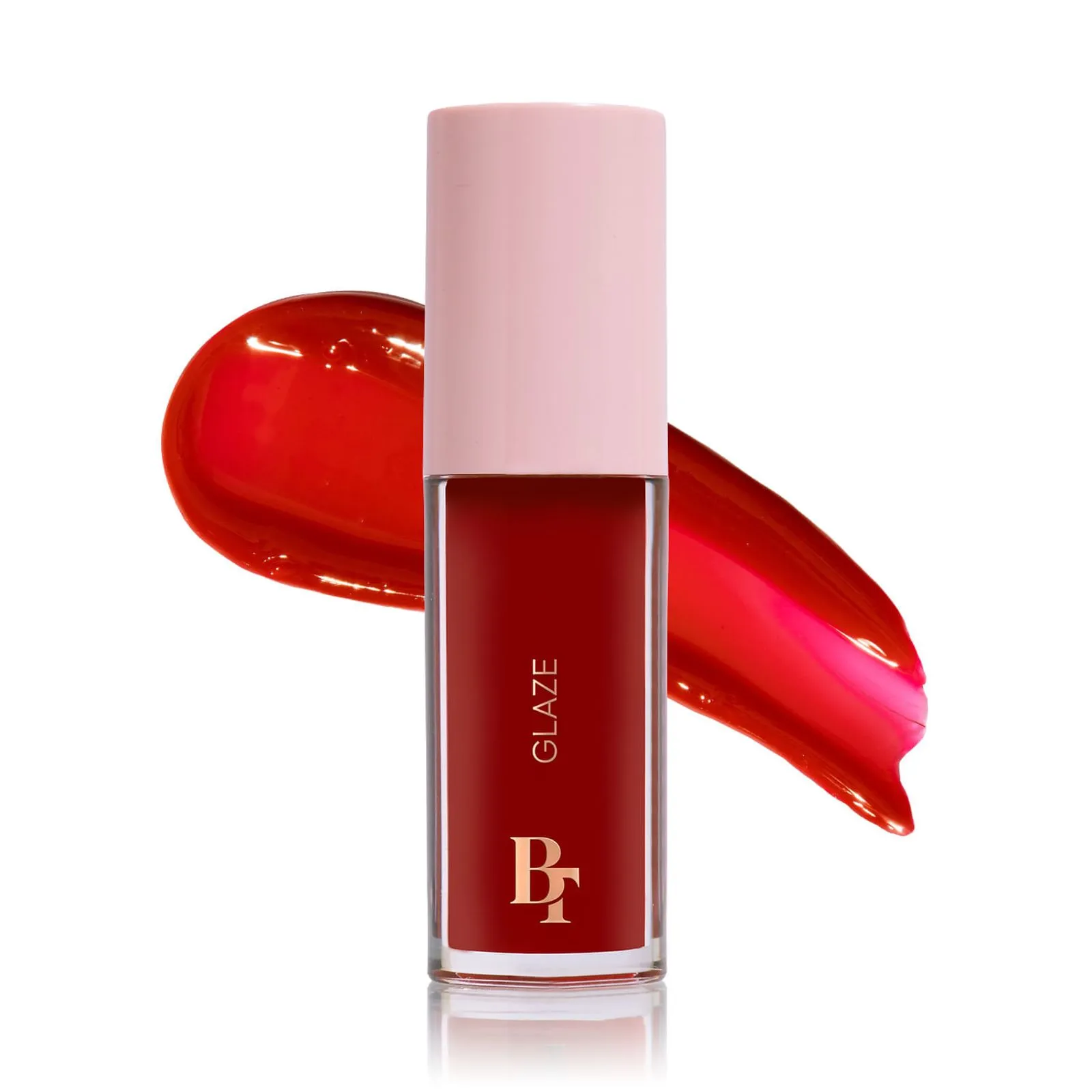 Verniz líquido para lábios vermelho em embalagem com tampa rosa e texto dourado
