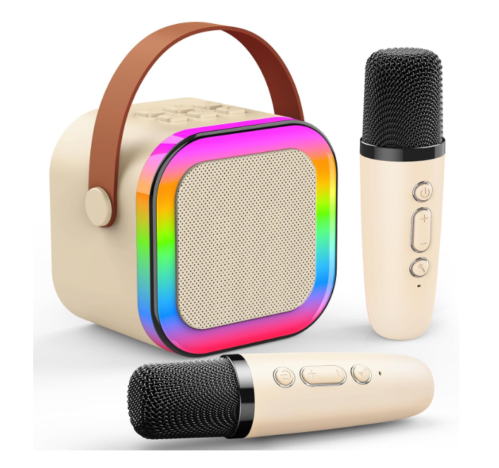 Colunas portáteis bege com alça castanha e moldura multicolorida, dois microfones sem fios bege com grelha preta.