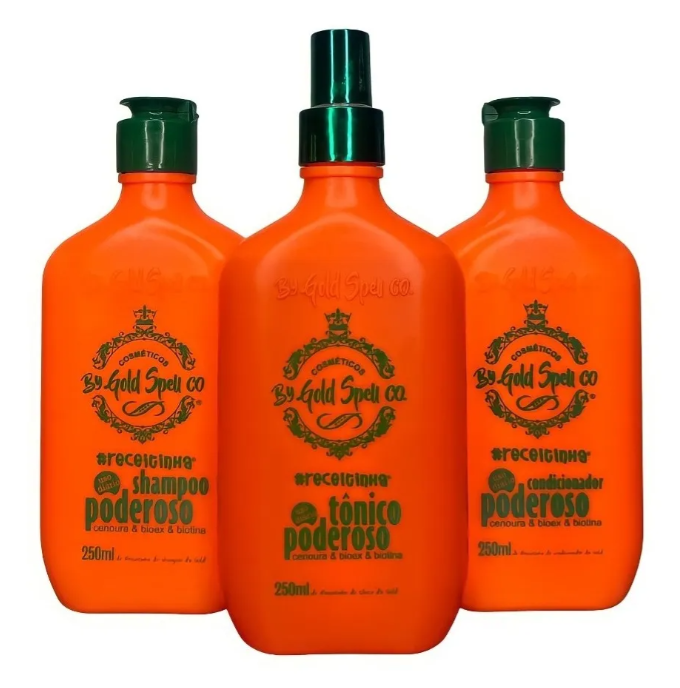 Três frascos alaranjados com tampa verde de produtos By Gold Spell Co.