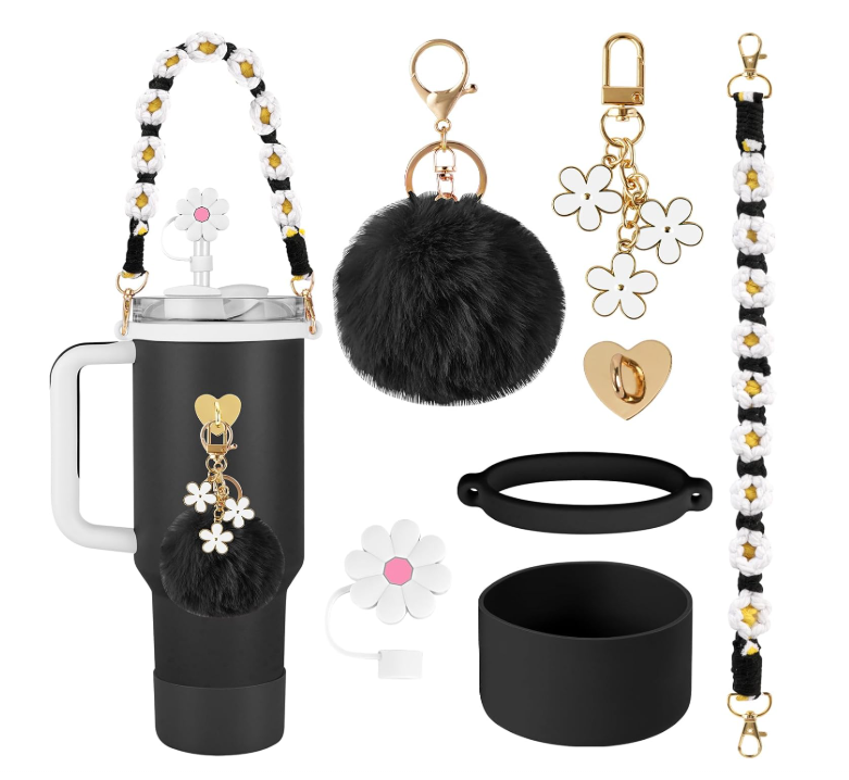 Conjunto de garrafa térmica preta e acessórios decorativos com temas de flores brancas e amarelas