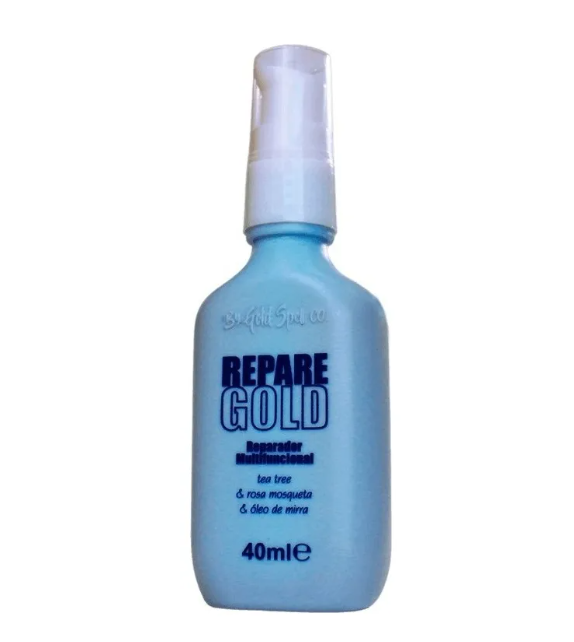 Frasco azul com bomba doseadora branca de produto cosmético REPARÉ GOLD