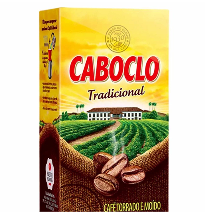 Embalagem de café Caboclo Tradicional com design amarelo, campos de café e grãos na frente