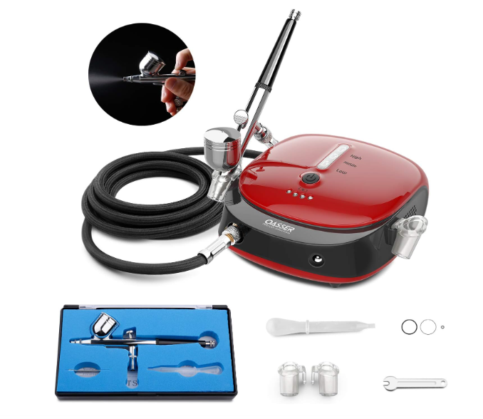 Kit de aerógrafo com compressor vermelho e preto e acessórios organizados