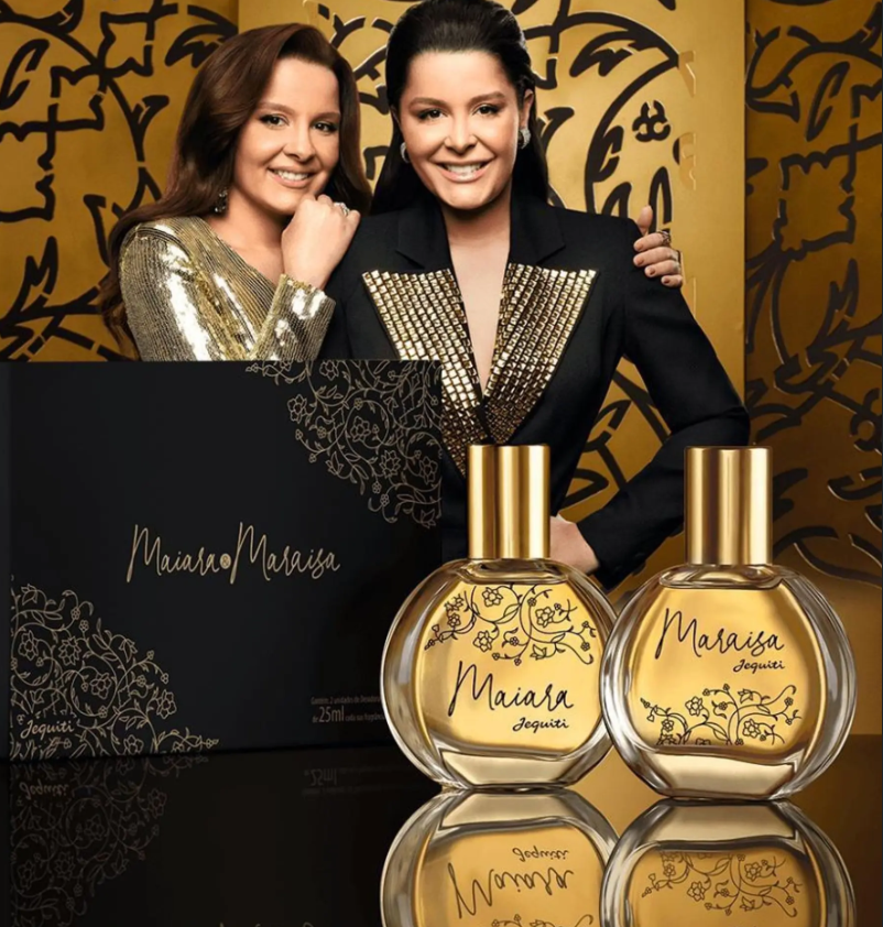 Conjunto de perfumes Maiara e Maraisa Jequiti com frascos e caixa preta decorada.